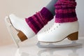 Female legs in gaiters and ice skates Royalty Free Stock Photo