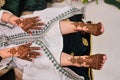 Female legs and hands with henna tattoo. Royalty Free Stock Photo