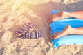 Female legs on the mattress, sea beach Royalty Free Stock Photo