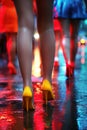 female legs of prostitute girls in miniskirts and high heels at night on street Royalty Free Stock Photo