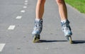 Female legs in roller blades Royalty Free Stock Photo