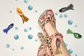 Female legs in sandals with an animal print Royalty Free Stock Photo
