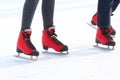 Female legs in skates on an ice rink Royalty Free Stock Photo