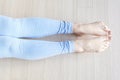 Female legs in socks bend and unbend feet, home workout concert, top view. Royalty Free Stock Photo