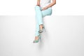 female legs in turquoise trousers and high heels shoes Royalty Free Stock Photo
