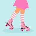 Female legs wearing retro roller skates and striped socks. Rollerblading girl. Royalty Free Stock Photo
