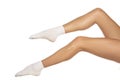 Female legs in white short socks