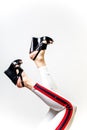 Female legs in white trousers and shoes Royalty Free Stock Photo