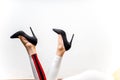 Female legs in white trousers and shoes Royalty Free Stock Photo