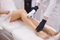 Female legs, woman in professional beauty clinic during laser hair removal