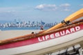 A female lifeguard watches over swimmers at Locarno beach, Vancouver. face blurred out