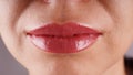 Female lips after permanent tattooing close up