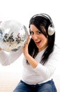 Female listening music and holding disco ball Royalty Free Stock Photo