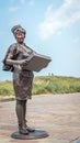 Female living statue of a waitress at the beach boulevard