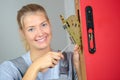 Female lock smith posing and smiling Royalty Free Stock Photo