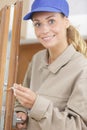 Female lock smith posing and smiling Royalty Free Stock Photo