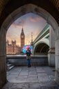 Female London tourist with a union jack umbrella in front of the Big Ben Royalty Free Stock Photo