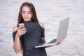 Female long-haired office administrator with notebook and telephone Royalty Free Stock Photo