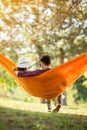 Female lying down in hammock and rest Royalty Free Stock Photo