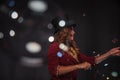 Female magician makes with soap bubbles show, an illusionist Royalty Free Stock Photo