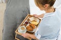 Female maid with breakfast tray Royalty Free Stock Photo