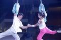 Female and male acrobats rehearse