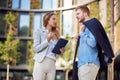 Female and male business cowokers discussing