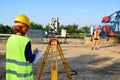 Two land surveyors at work