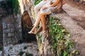 Female and male feet on the rocks