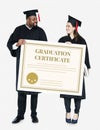 Female and male grad holding a graduation certificate Royalty Free Stock Photo