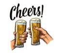 Female and male hands holding and clinking with two glasses beer Royalty Free Stock Photo