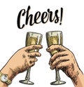 Female and male hands holding and clinking with two glasses champagne.
