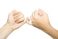 Female and male hands reconcile with clasping each other