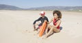 Female and male lifeguards patrolling beach