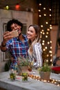 Female and male making selfie