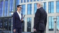 Female and male managers meeting outside office, business colleagues teamwork