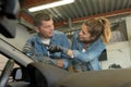 female male mechanic at workshop