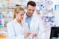 Female and male pharmacists Royalty Free Stock Photo