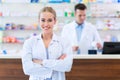 Female and male pharmacists Royalty Free Stock Photo