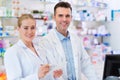 Female and male pharmacists Royalty Free Stock Photo