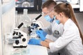 Female and male scientists working in laboratory