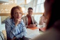 A female manager is having a conversation with her female colleague during a meeting in the office. Business, people, office, Royalty Free Stock Photo