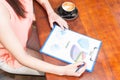 Female manager outside on terrace reading profit and predictions Royalty Free Stock Photo