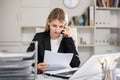 Female manager talking on phone in office Royalty Free Stock Photo