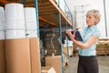 Female manager using digital tablet in warehouse Royalty Free Stock Photo