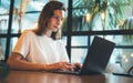 Female manager using laptop at office workplace, girl freelancer writing on keyboard at coworking, businesswoman working