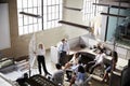 Female manager using whiteboard in a meeting, elevated view