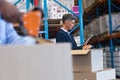 Female manager working on digital tablet in warehouse Royalty Free Stock Photo