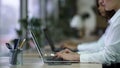 Female manager working on laptop at company support center, contacting clients Royalty Free Stock Photo