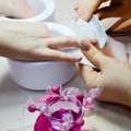 Female manicure procedure in beautician salon